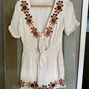 Cream Floral Romper with tie cutout.